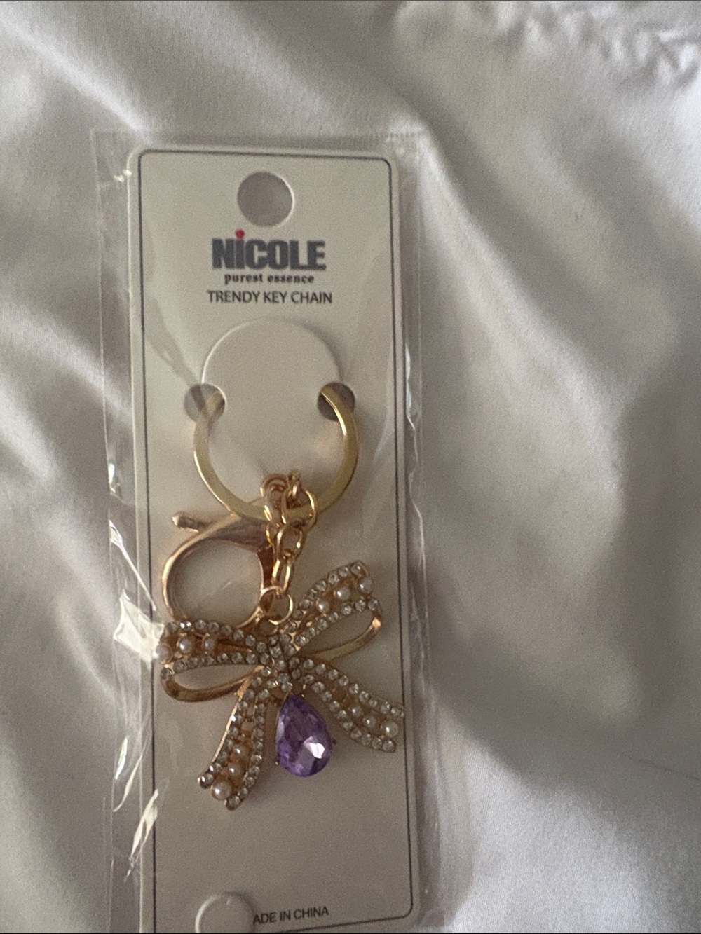 Nicole Gold Bow Keychain with Purple Teardrop Charm
